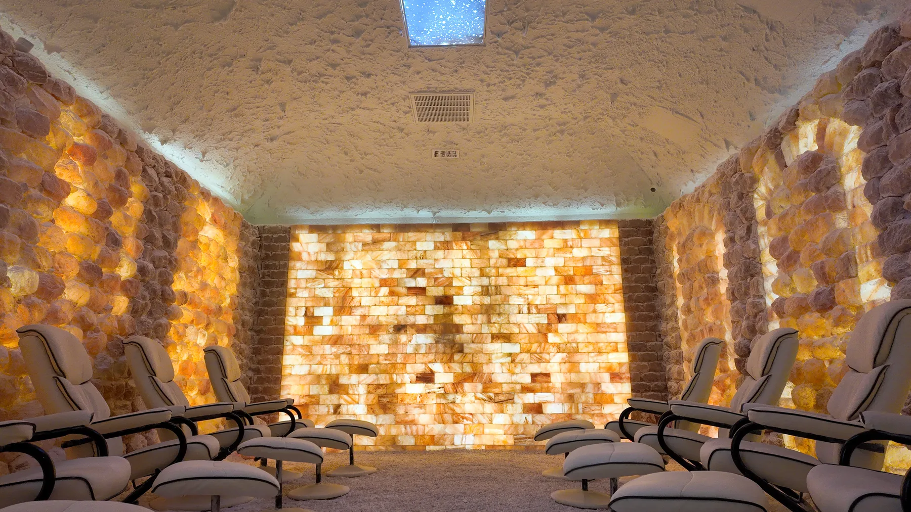 Zero-gravity chairs inside the Himalayan salt room at The Salt Room